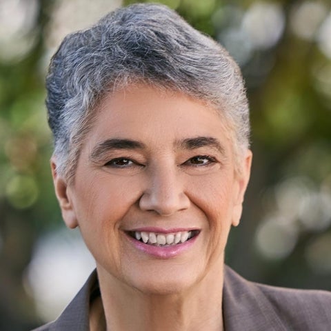 Bella DePaulo wears a gray suit